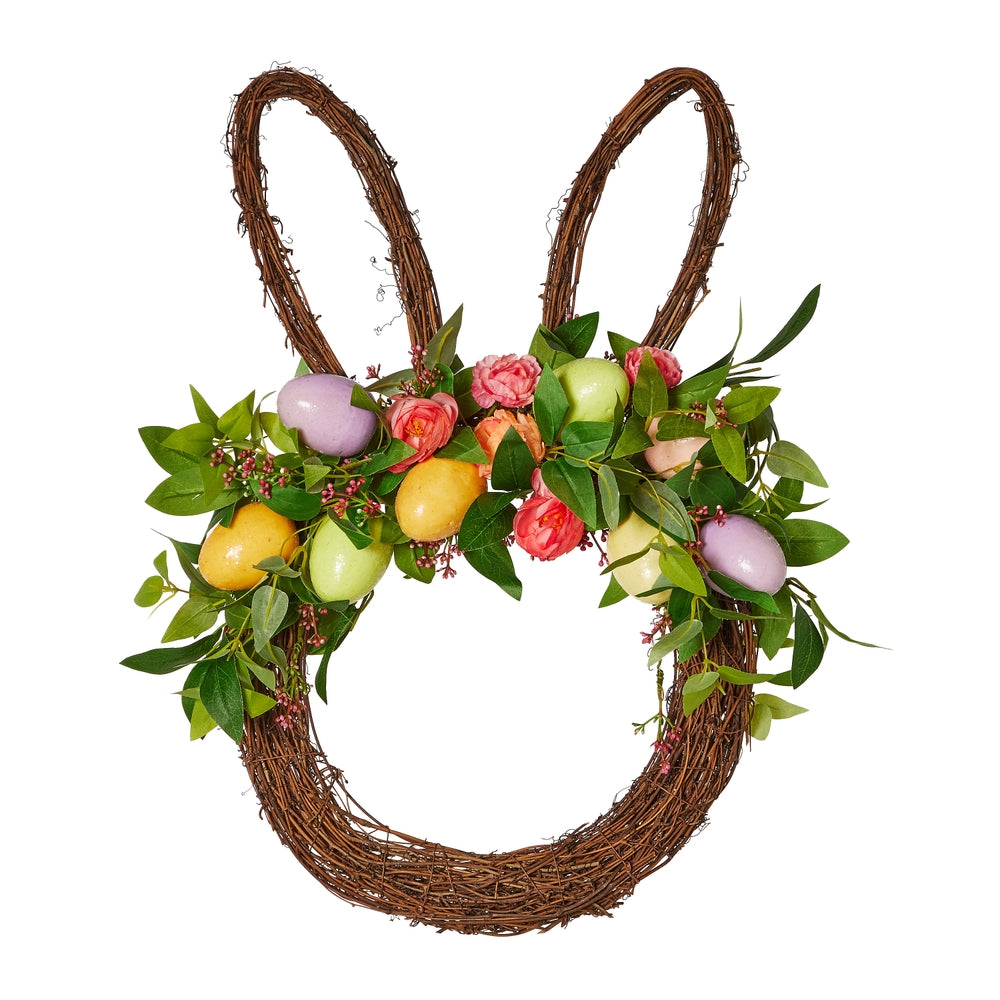 Polyester Easter bunny head wreath with white ears on a pink floral background.