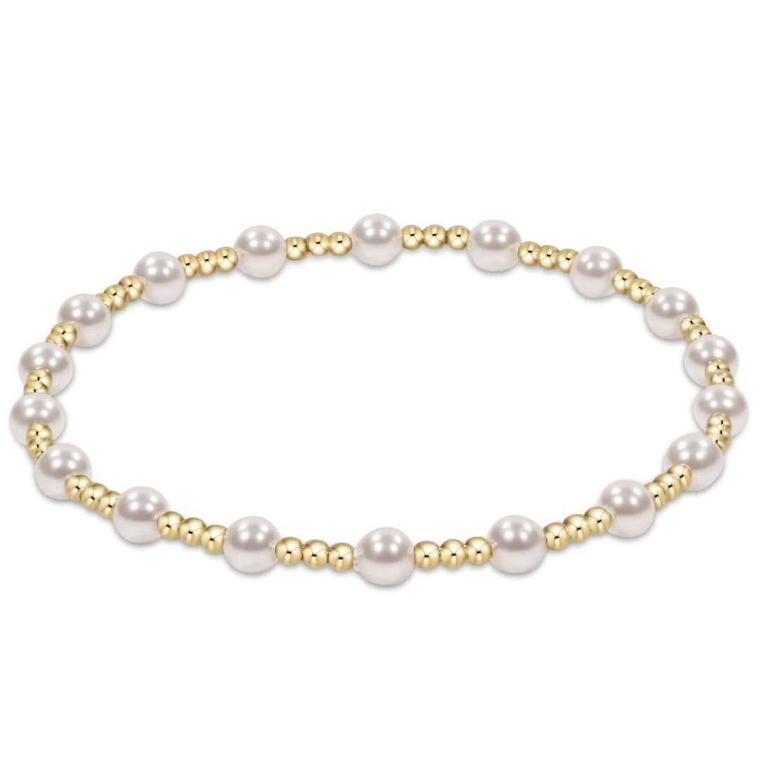 Extends Sincerity bracelet featuring alternating 4mm crystal pearls and 2mm gold-filled beads on stretch elastic.