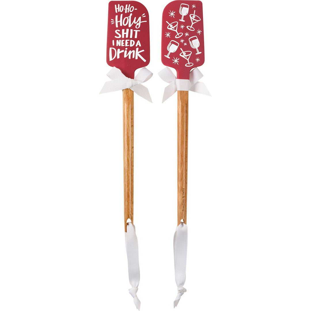 Wood-handled silicone spatula with red Christmas-themed head.