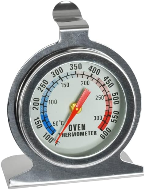 Stainless steel dial oven thermometer with a red needle pointing to temperature readings.