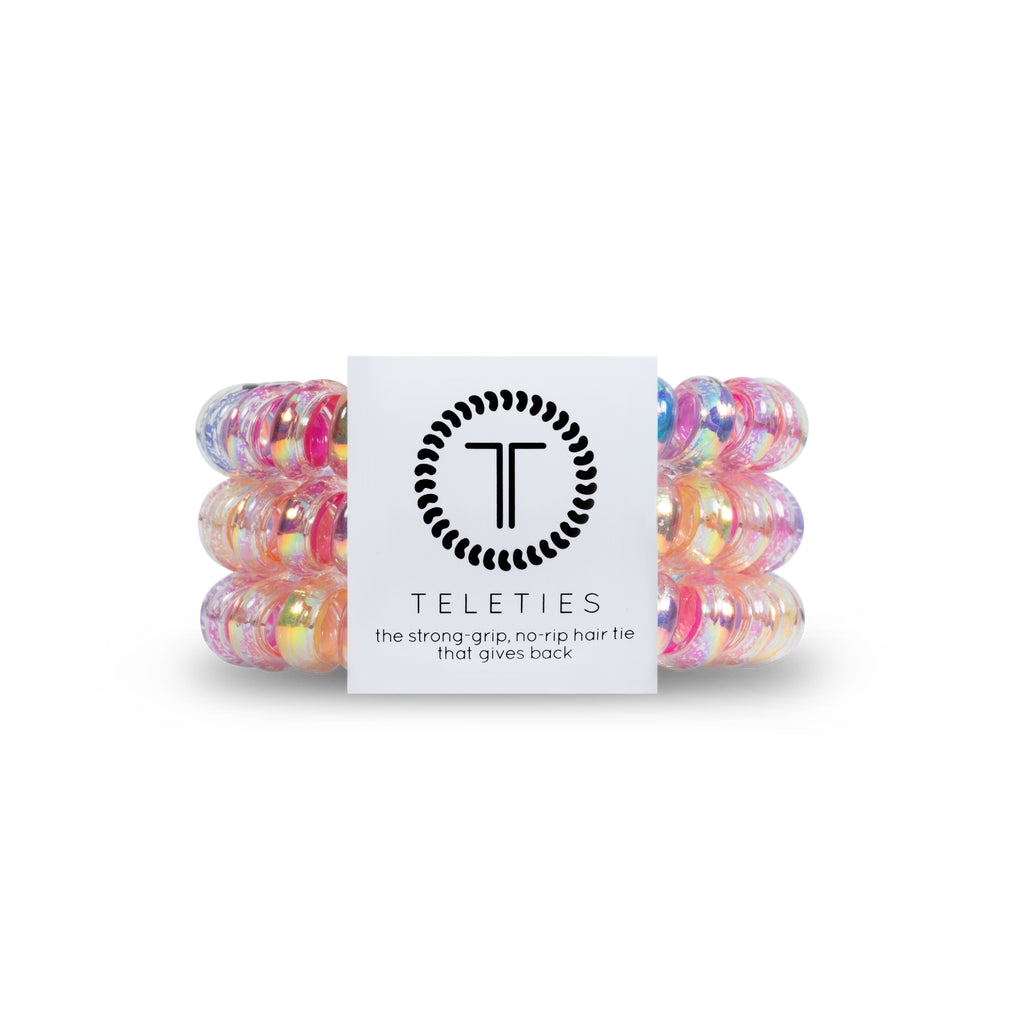 Three large spiral hair coils in a neutral tone with an open coiled pattern.