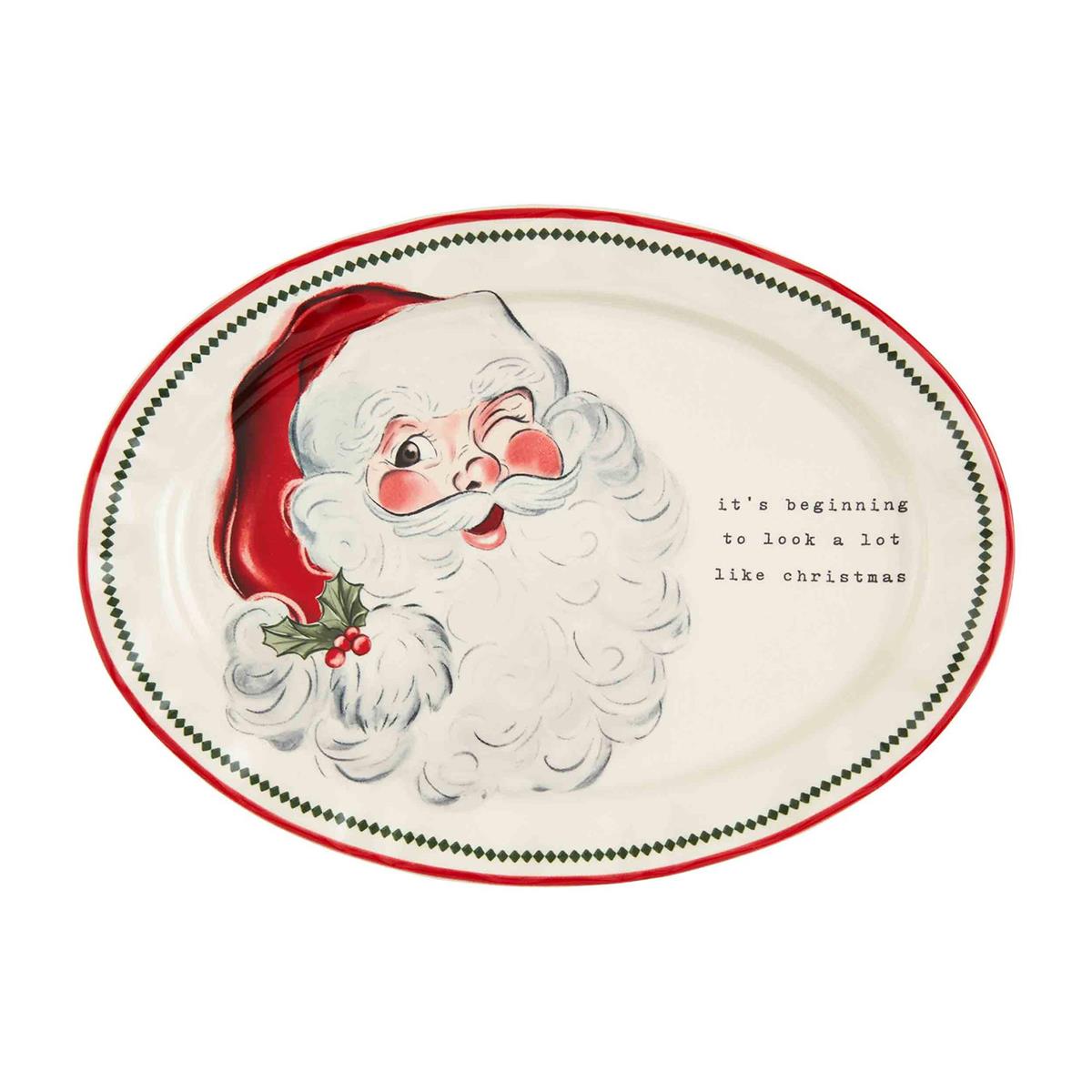 Round stoneware platter with vintage Santa Claus illustration in red and white.