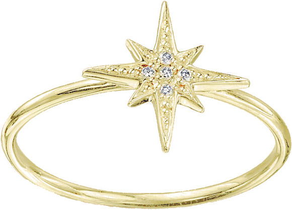 Gold ring with a central eight-pointed starburst design set with small clear stones.