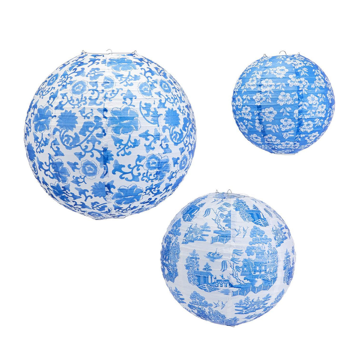 Three round paper lanterns with blue and white Chinoiserie patterns: floral, floral with leaves, and scenic landscape.