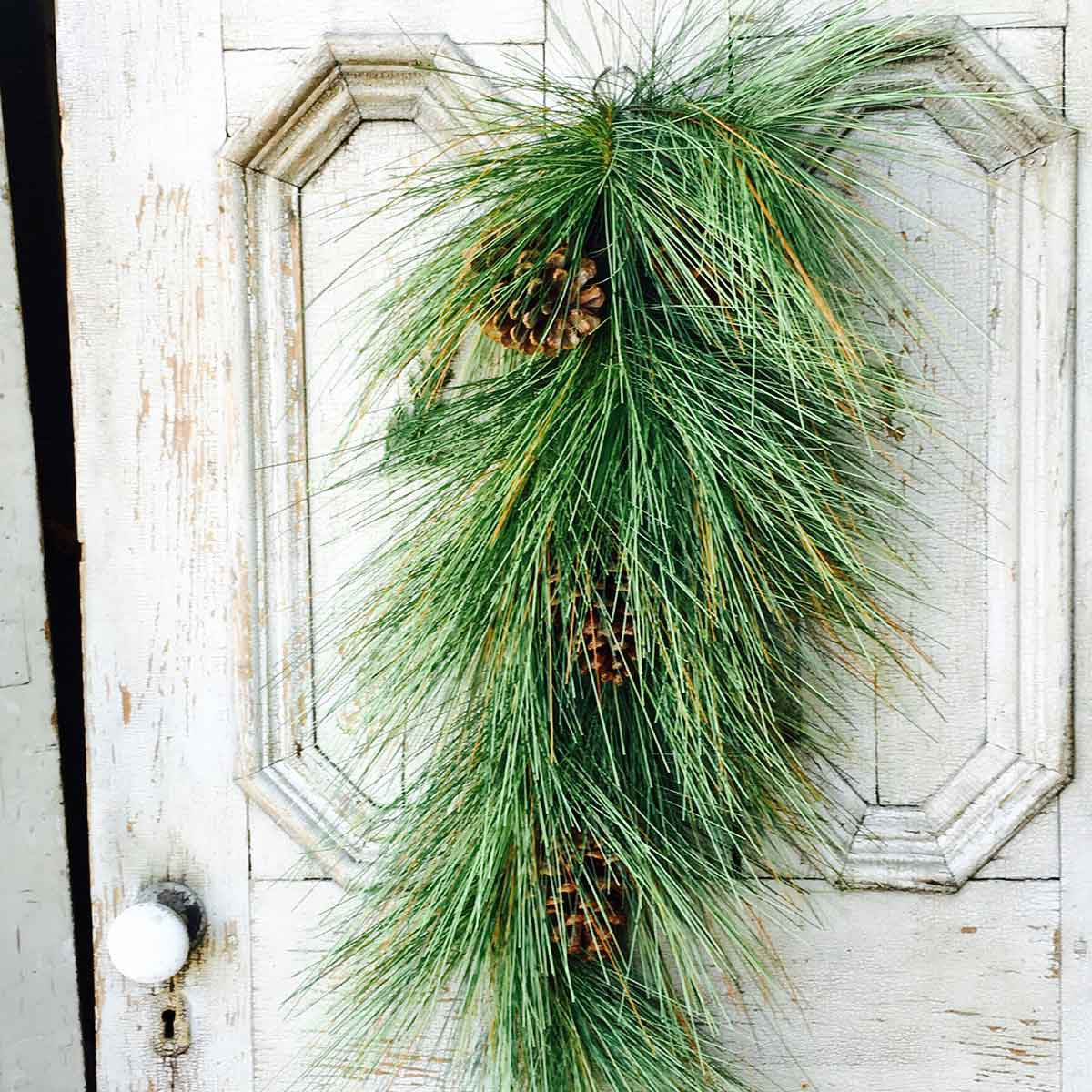 32-inch Giant Pine artificial Christmas tree with Sugar Cone Tear Drop branches in natural green.