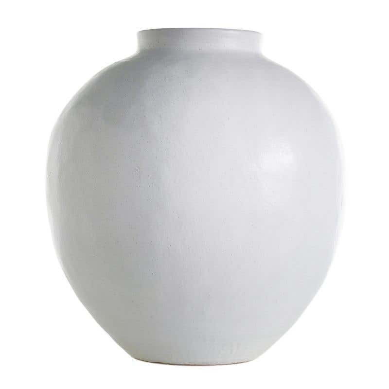 White ceramic Santorini vase with a fluted body and narrow neck.