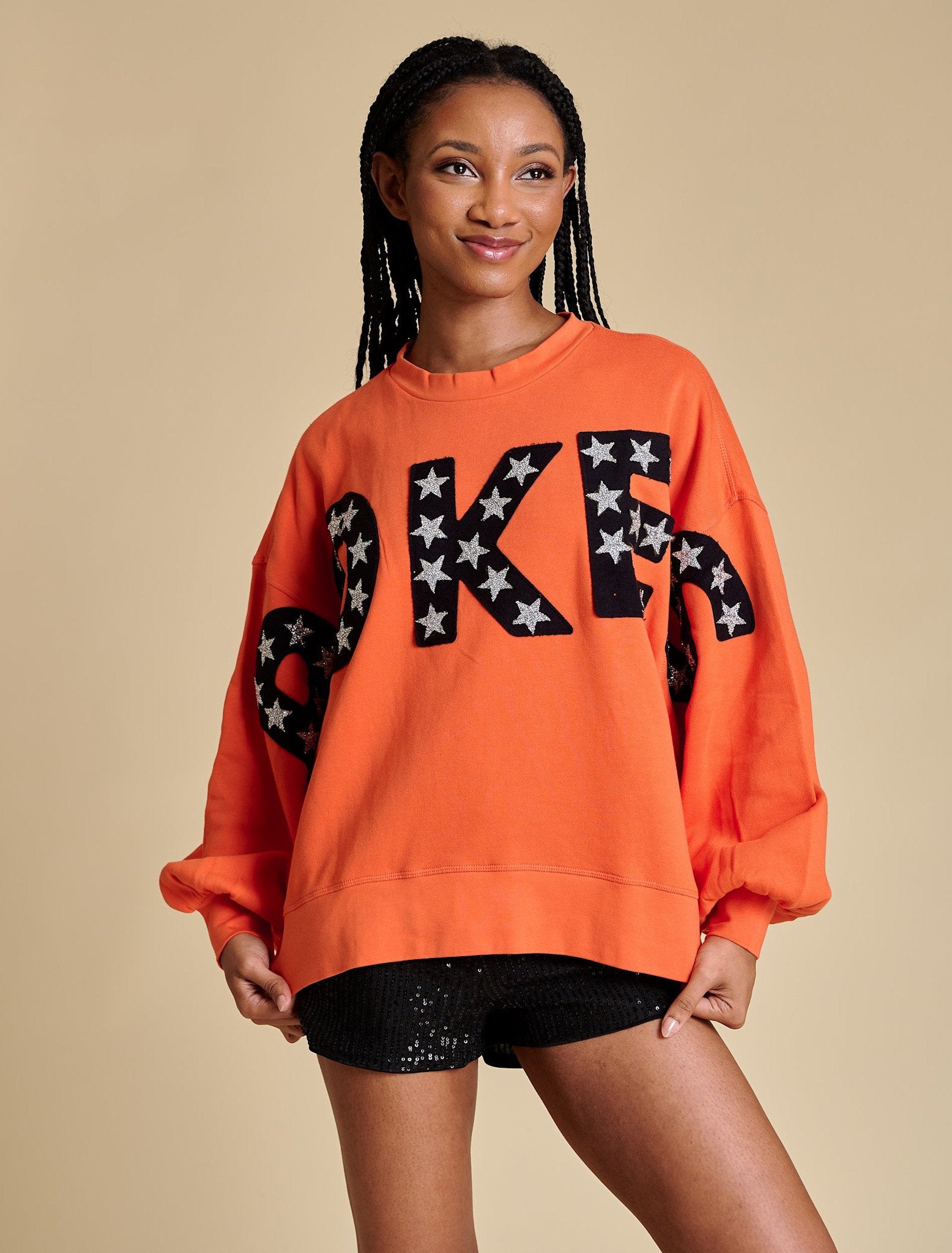 Relaxed fit pullover with voluminous balloon sleeves in a soft neutral tone.