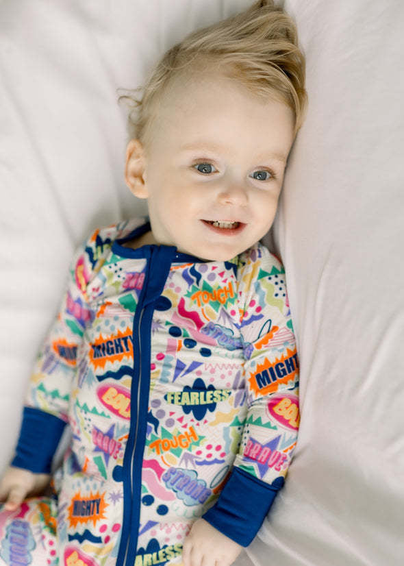 Front view of The Mighty Mack Boy Zippy zip-up top in playful print made from bamboo viscose and spandex.