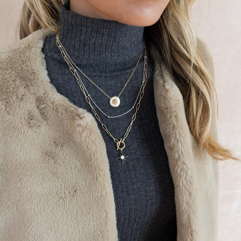 Diamond North Star pendant necklace on a silver chain with celestial star motif.