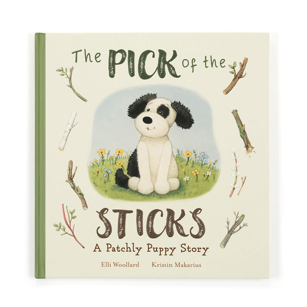 Paper board book cover featuring a black and cream puppy named Bashful holding a stick against a light background.