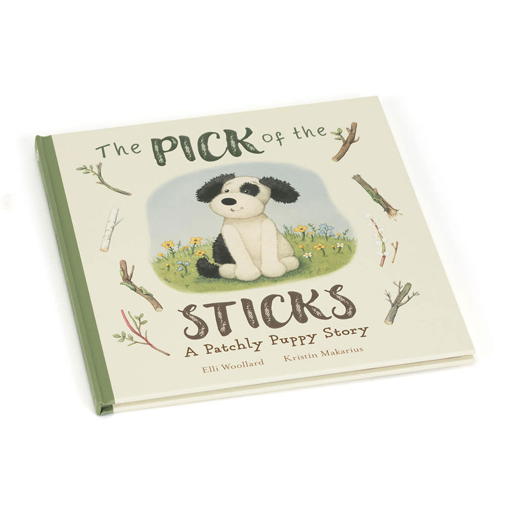 Paper board book cover featuring Bashful Black & Cream puppy holding a stick against a light background.