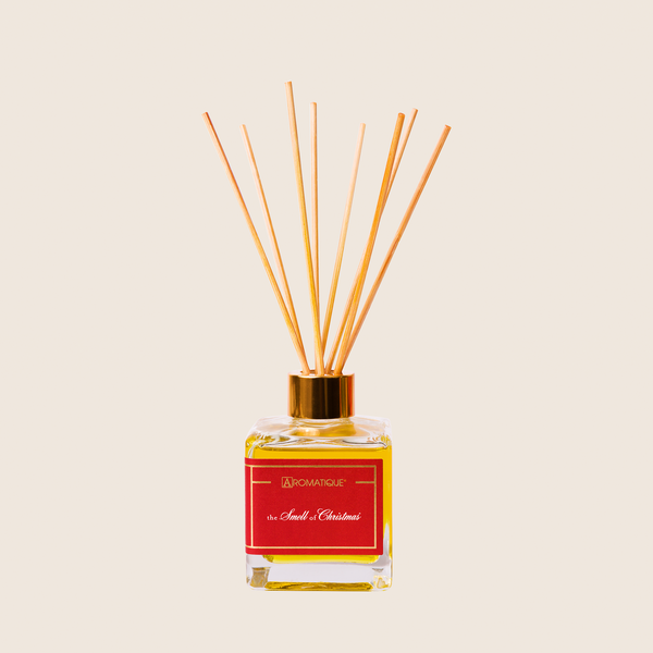 Textured glass bottle reed diffuser with warm Christmas scented fragrance