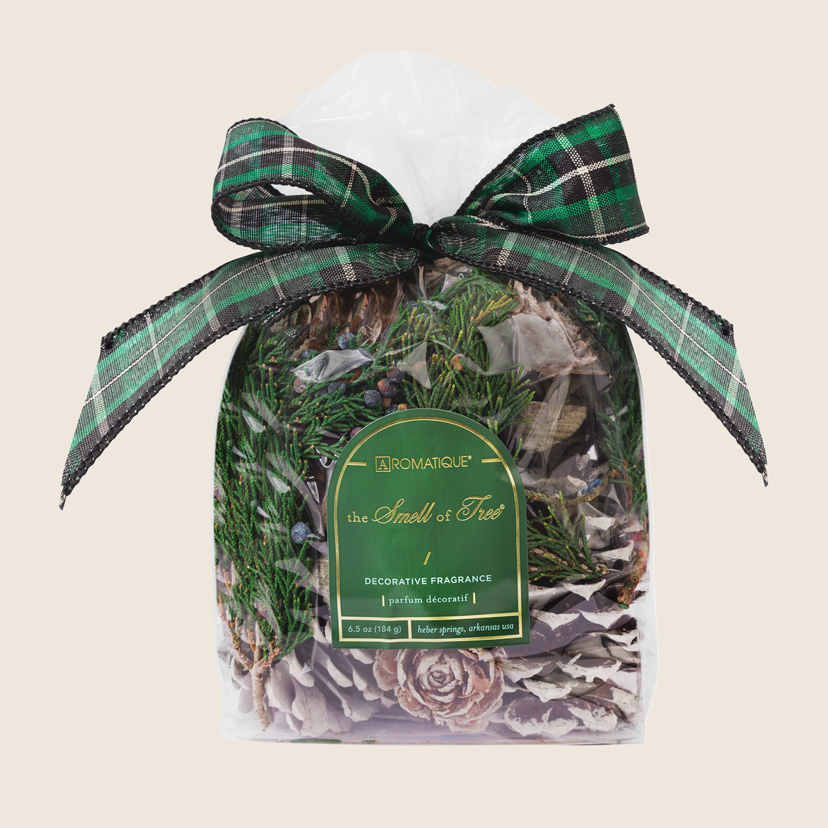 The Smell of Tree decorative fragrance in a dark cylindrical container with pine, cedarleaf, and fir balsam notes.