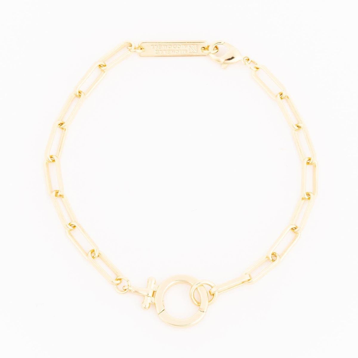 Gold Thea bracelet featuring a delicate chain with an oval pendant.