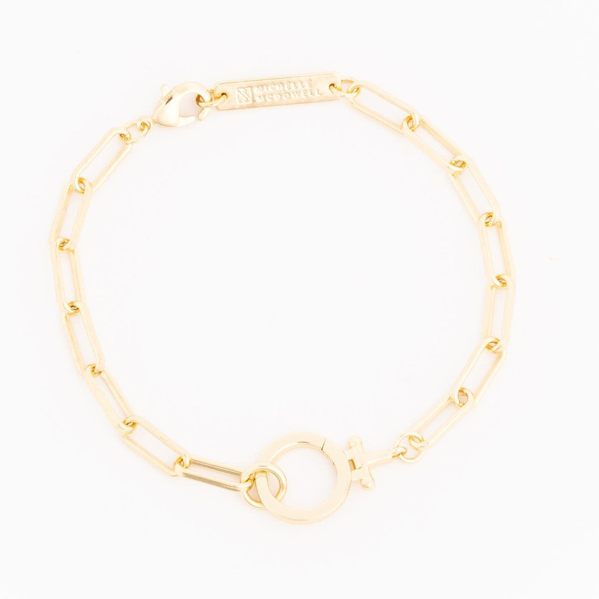 Thea gold bracelet featuring a delicate chain link design with polished metal finish.