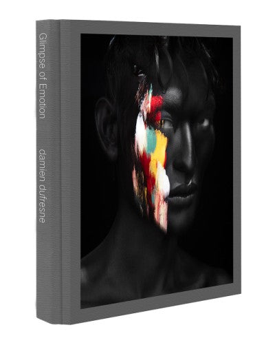 Glimpse of Emotion book cover featuring a black and white portrait with colorful paint strokes on the face.