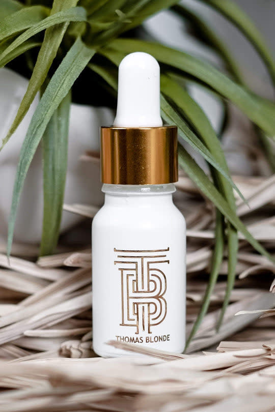 Bottle of Thomas Blonde Essential Volumizer Oil with Joshua Tree scent