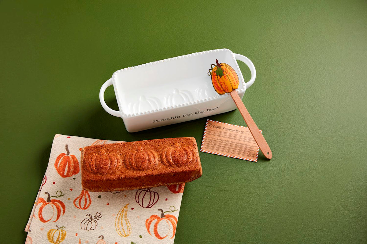 Pumpkin Bread Baker Set featuring a ceramic baking pan with an orange pumpkin silhouette and matching spatula.
