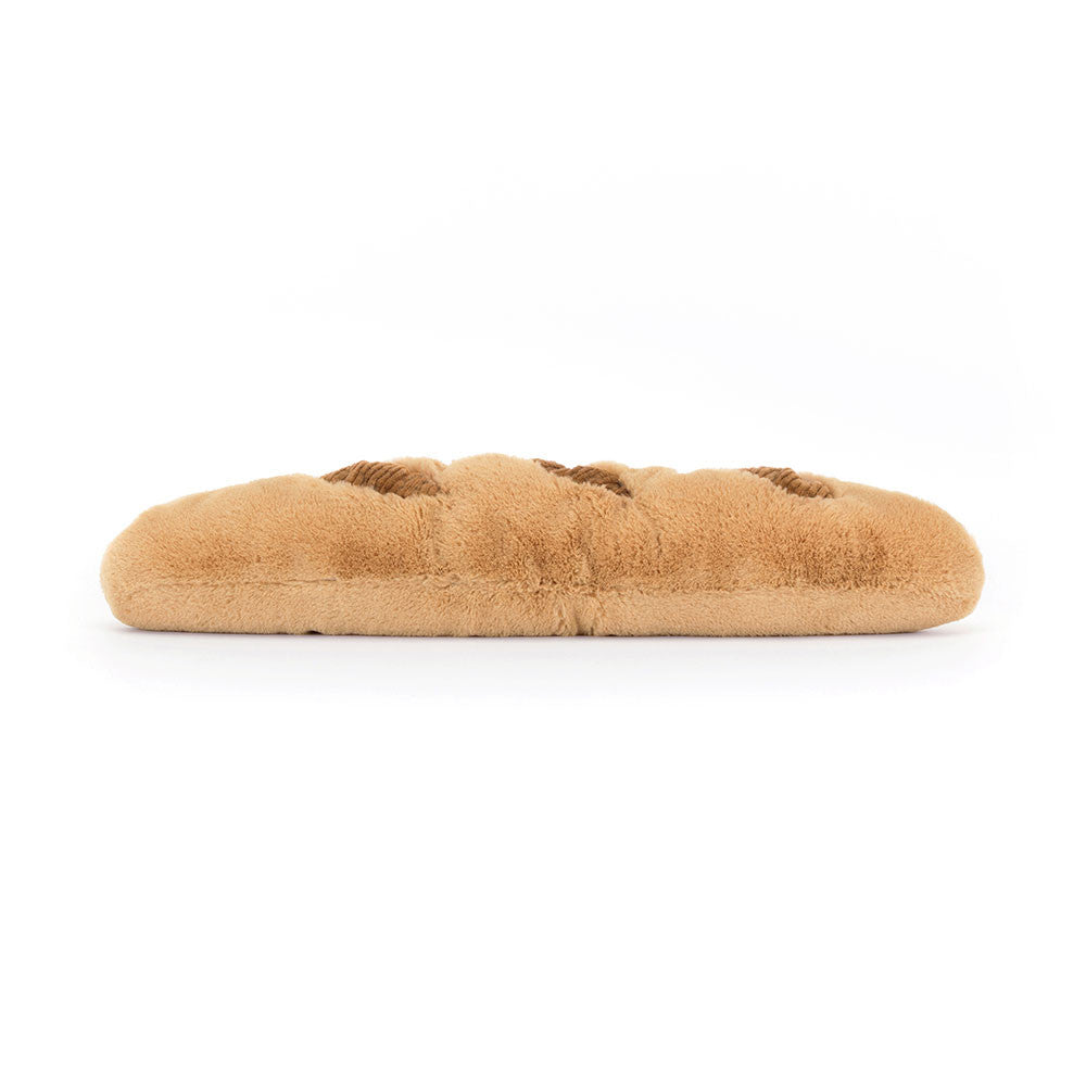 Long, soft plush baguette toy in golden-brown faux fur with three dark brown corduroy score marks.