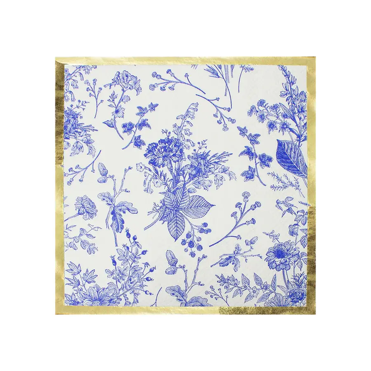 White cocktail napkin with blue floral print and metallic gold accents.