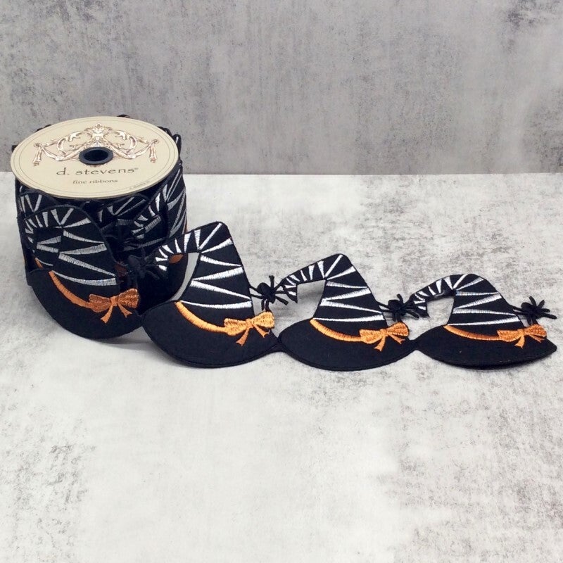 4-inch black witch hat garland with silver stripes and orange bows on a 5-yard spool.