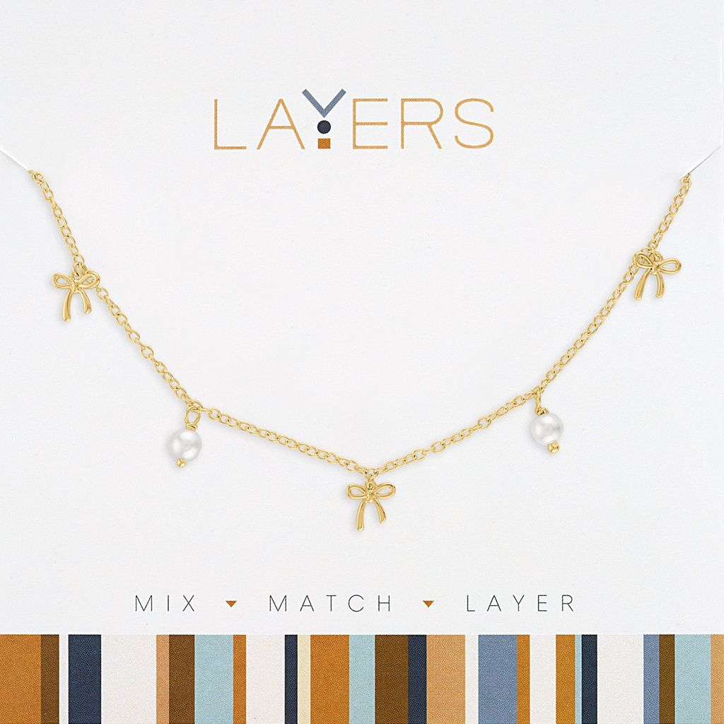 Gold-tone chain necklace featuring three bow charms and two petite white pearl drops.