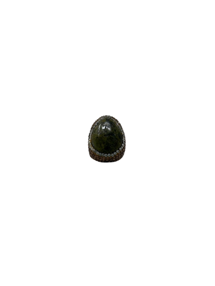 Fashion gemstone ring featuring a large dark green teardrop stone surrounded by small crystals.