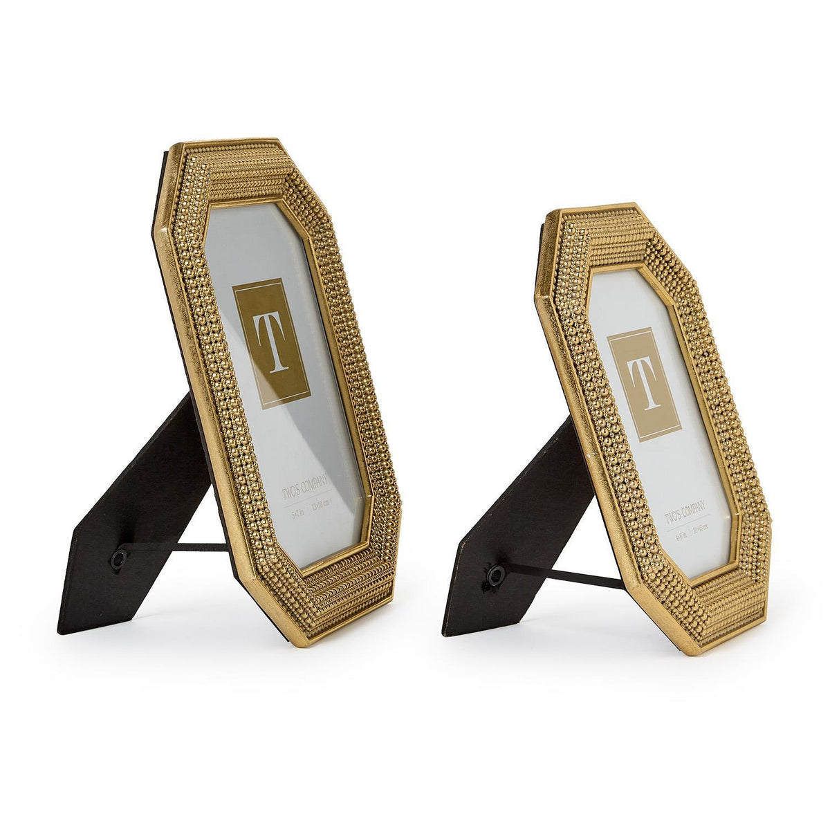 Two gold beaded octagonal photo frames in different sizes standing on a white surface.