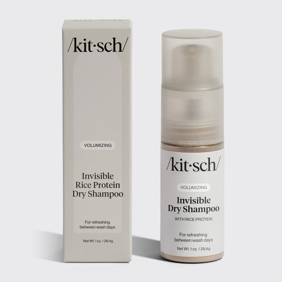 Volumizing Rice Protein Dry Shampoo pump bottle in light-tinted powder with compact travel design