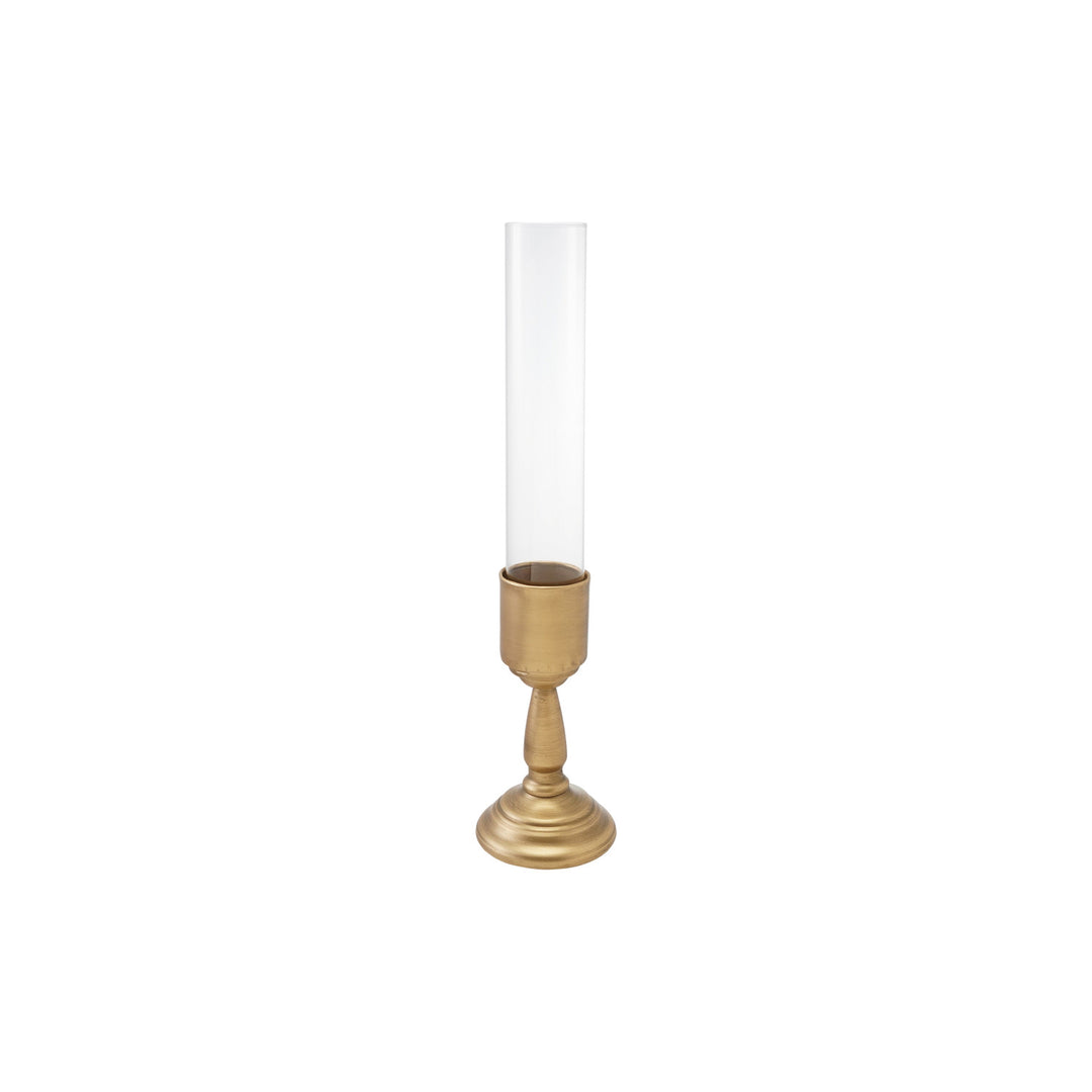 Gold finish metal taper holder with a tall, clear glass hurricane sleeve.
