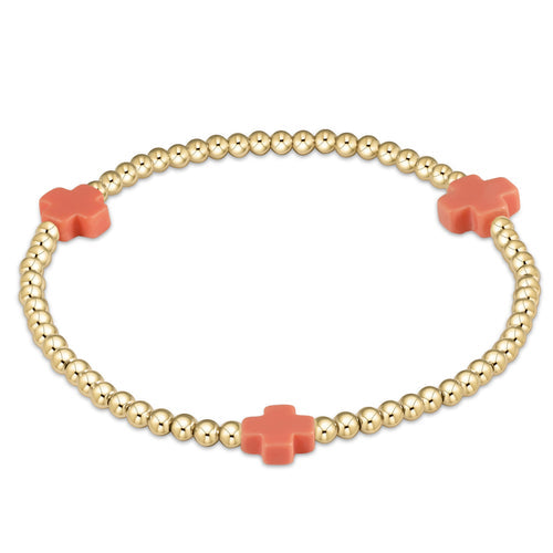 Gold-filled Signature Cross bead bracelet with a subtle cross pattern on high-performance elastic cord.
