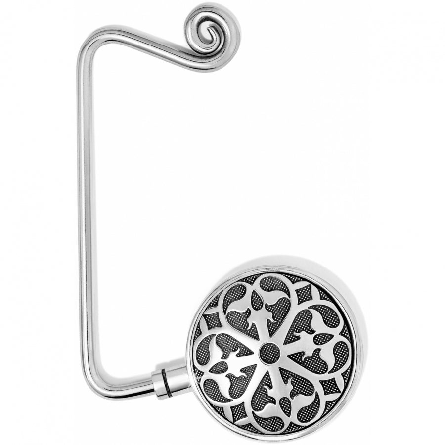 Silver-plated Ferrara handbag hook with a circular filigree design and a curved hanging arm.