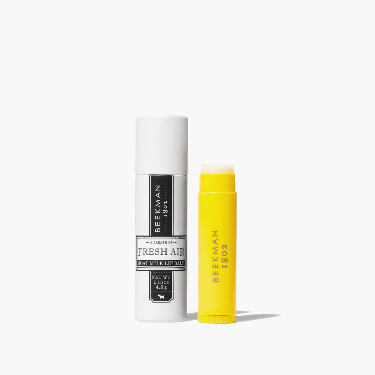 Beekman Lip Balm in a clear paper tube with gingham pattern packaging