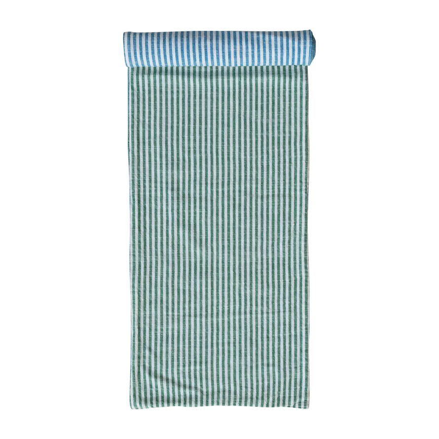 Woven cotton two-sided striped table runner in natural tones with a classic stripe pattern.