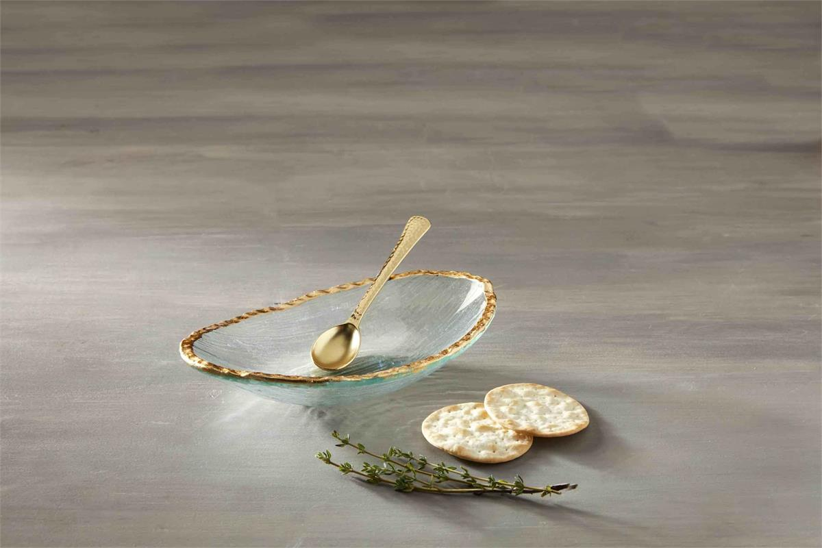 Gold Edge Dip Bowl Set featuring a glass dish with gold rim, gold spoon, crackers, and herbs.