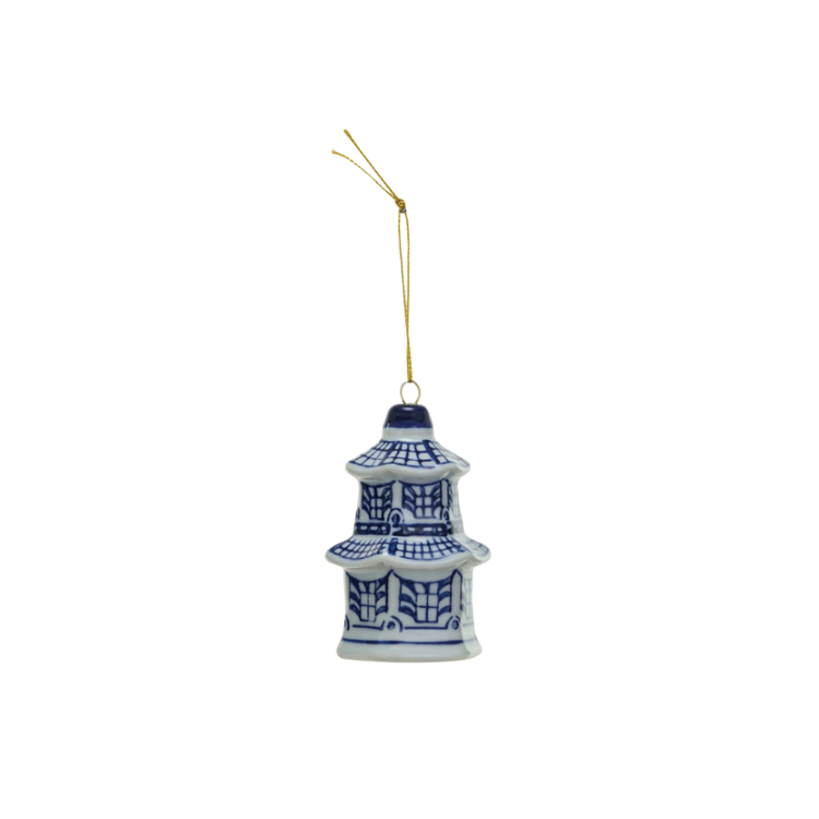 Blue and white stoneware pagoda-style ginger jar ornament with a gold hanging string.
