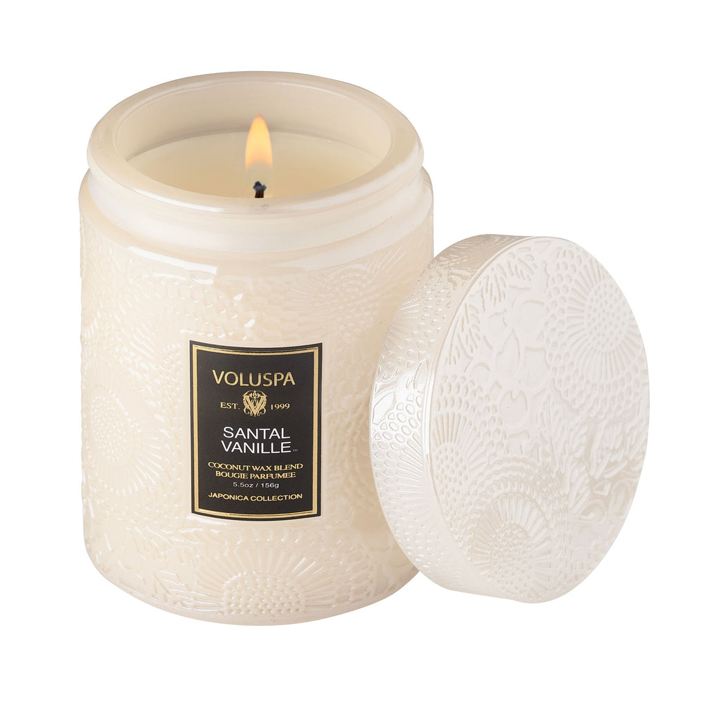 Santal Vanille candle in a clear glass jar with natural wick