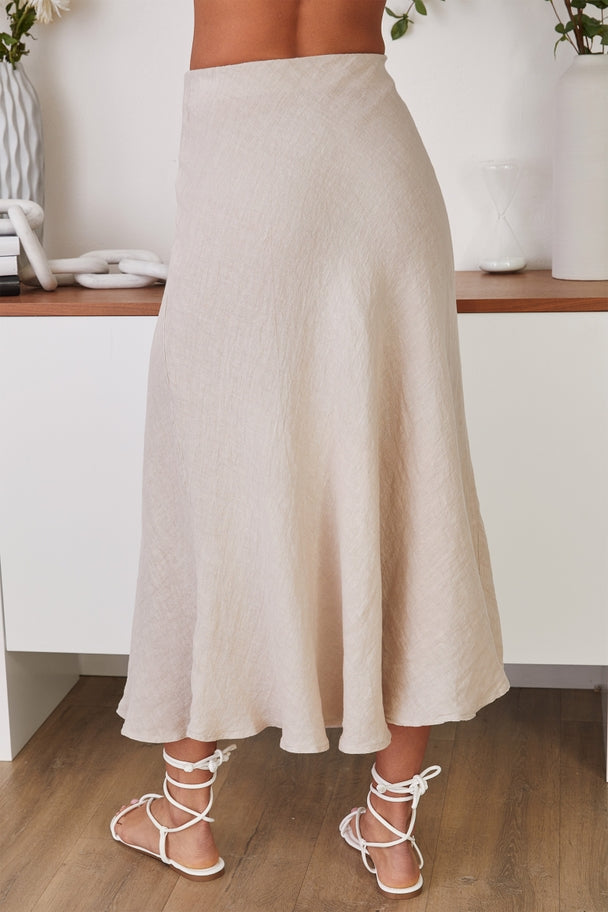 Eleanor crinkle linen midi skirt in natural color with a relaxed A-line silhouette and subtle texture.