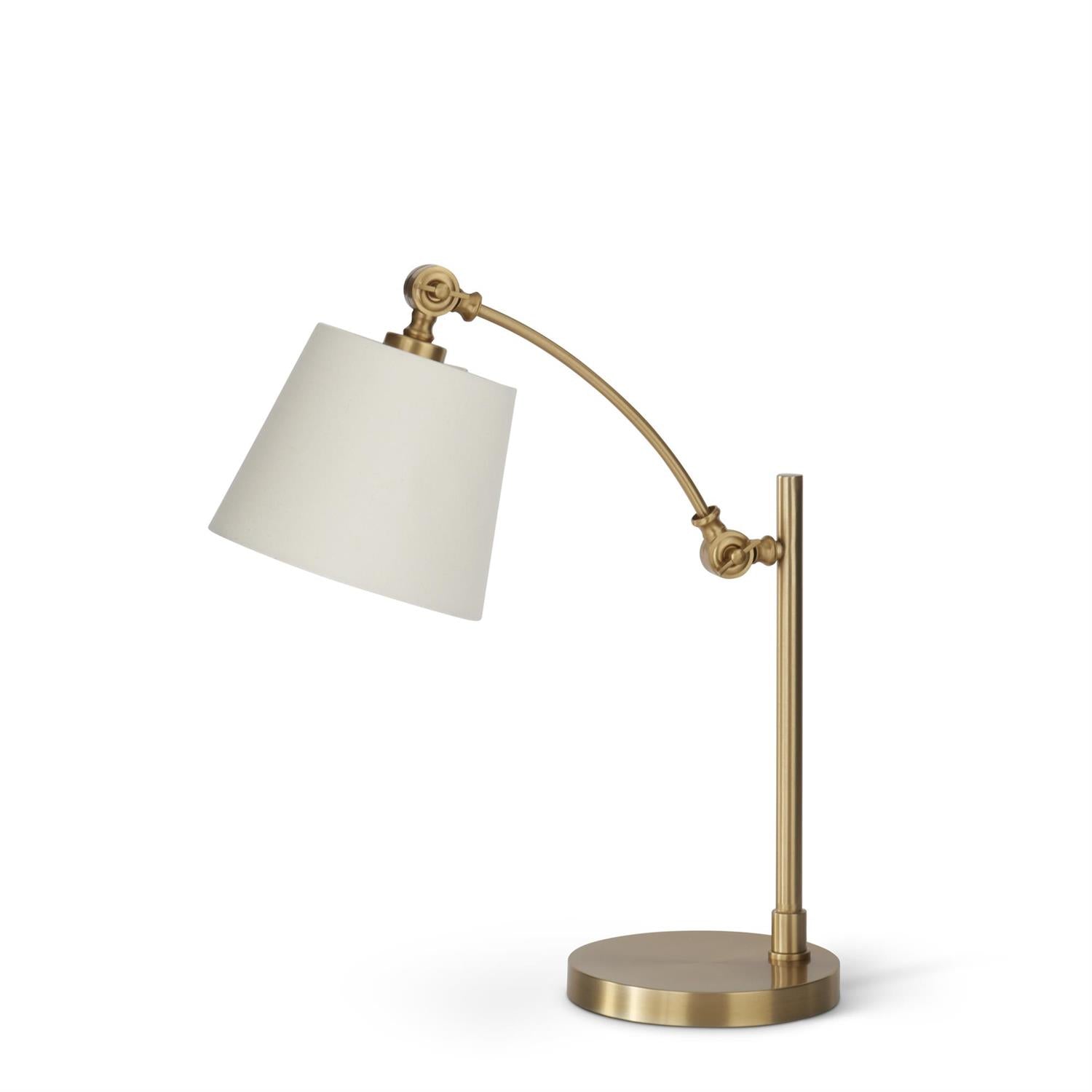 Adjustable gold metal desk lamp with cream fabric shade