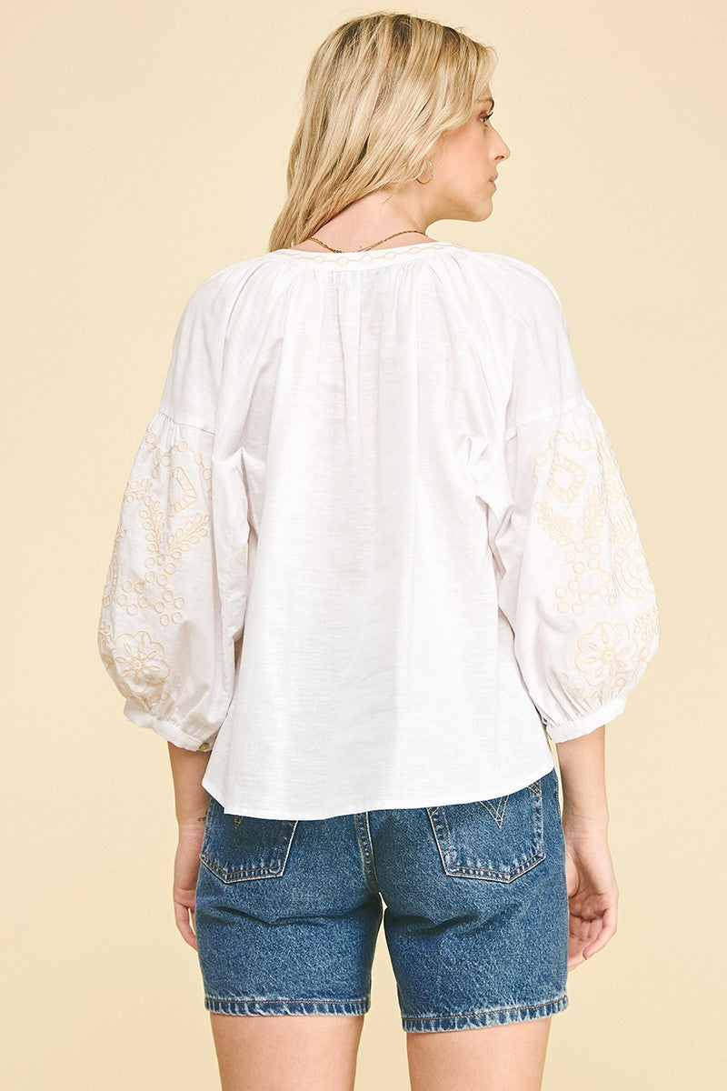 Women's Florence floral embroidered blouse in light beige cotton linen blend with a relaxed silhouette and delicate embroidery.
