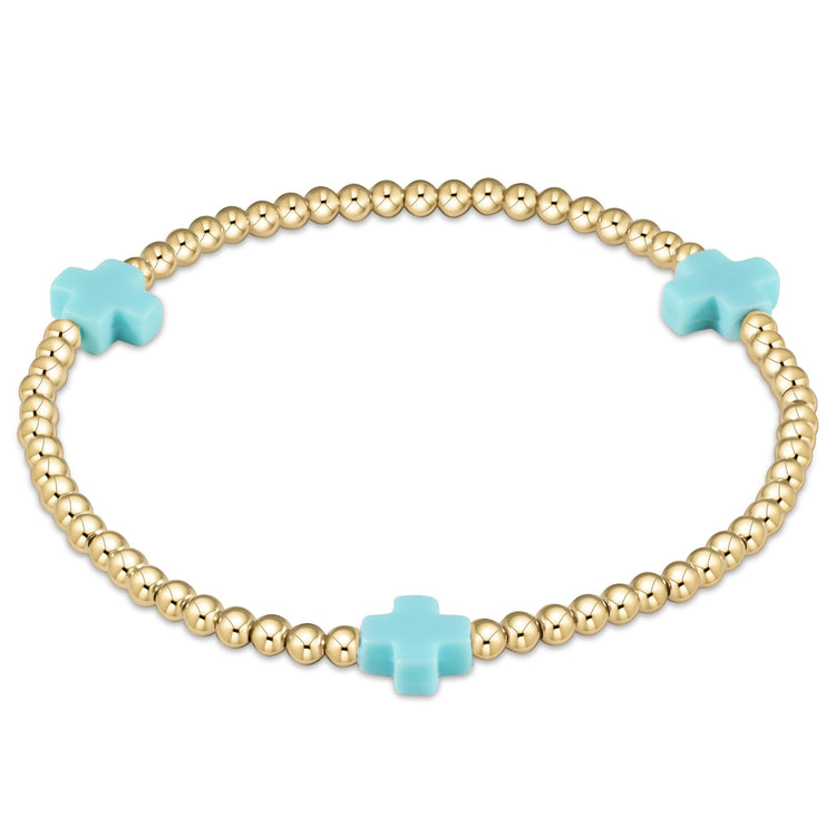 Enewton Signature Cross gold-filled bracelet with a cross bead pattern on high-performance elastic cord