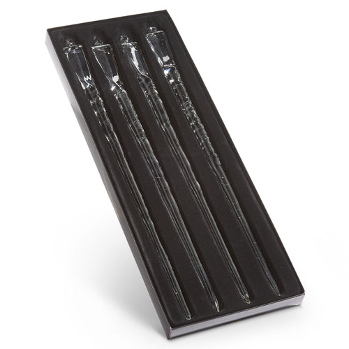 Set of four 15-inch clear glass icicle ornaments in a black display box.