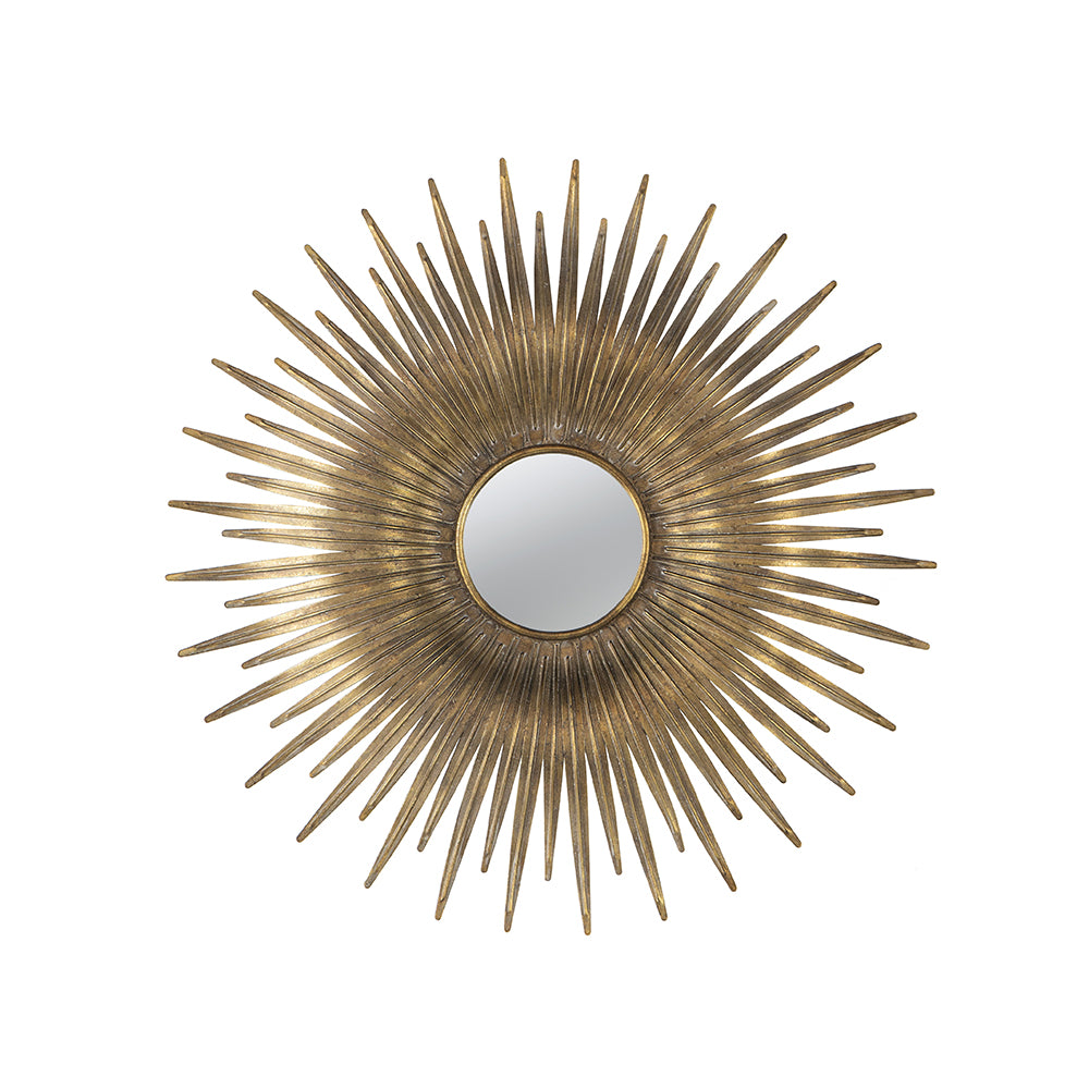 Round gold sunburst mirror with iron frame featuring radiating spikes.