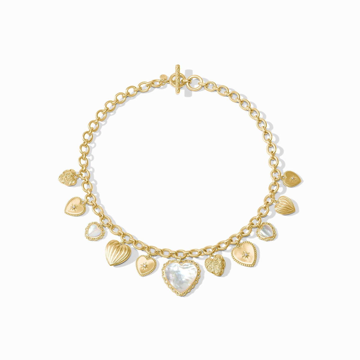 Gold heart charm necklace with mother of pearl and cubic zirconia accents on a toggle chain.