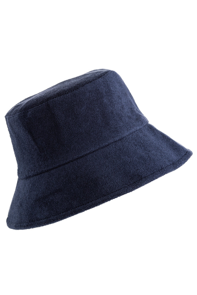 Terry cotton vegan bucket hat in neutral tone with a relaxed wide brim silhouette.