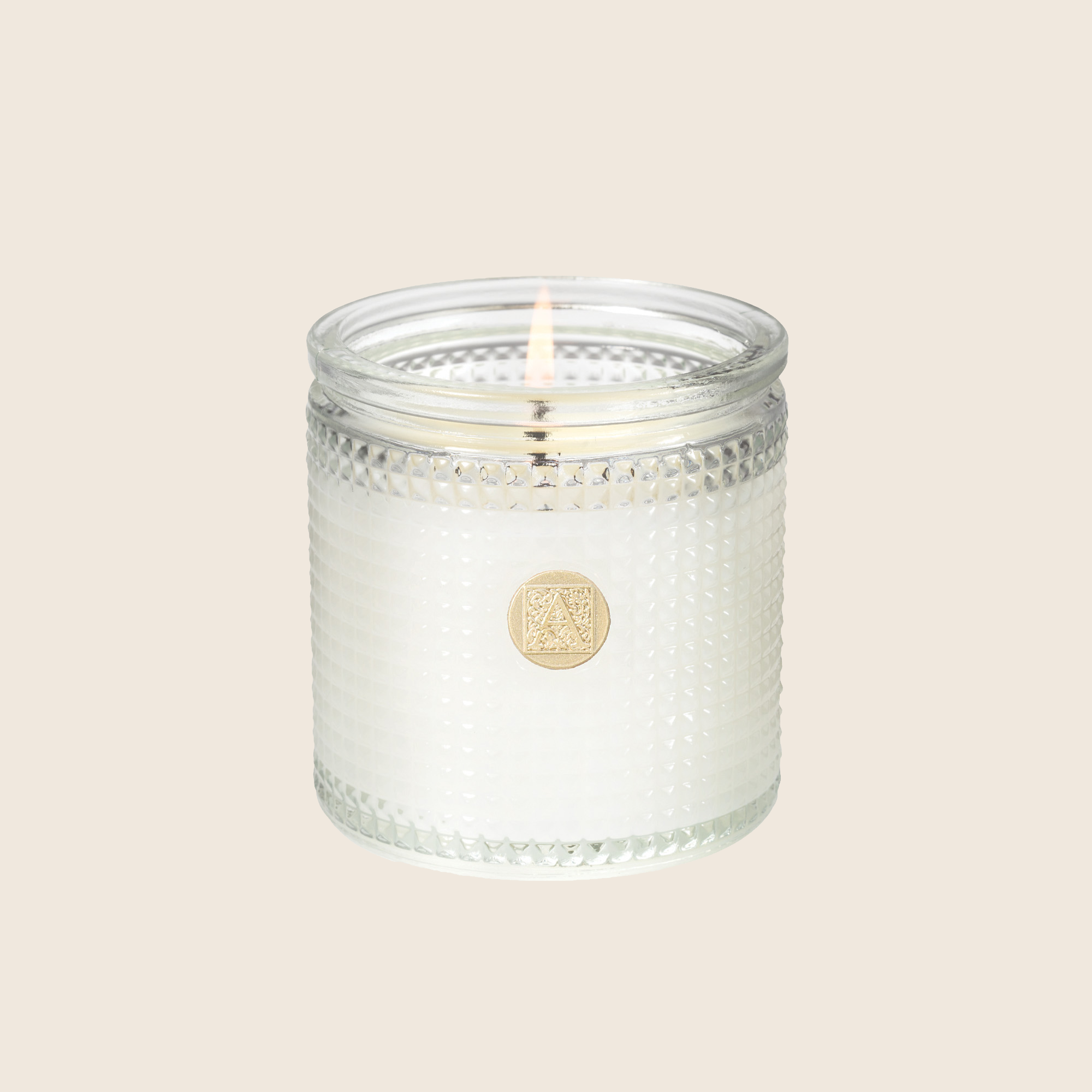 Clear glass cylinder candle with white textured wax in Juniper Berry scent.