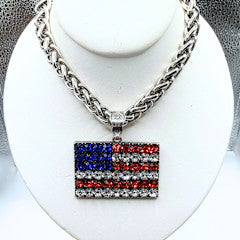 Silver chain necklace with a flag pendant featuring rhinestone detailing.
