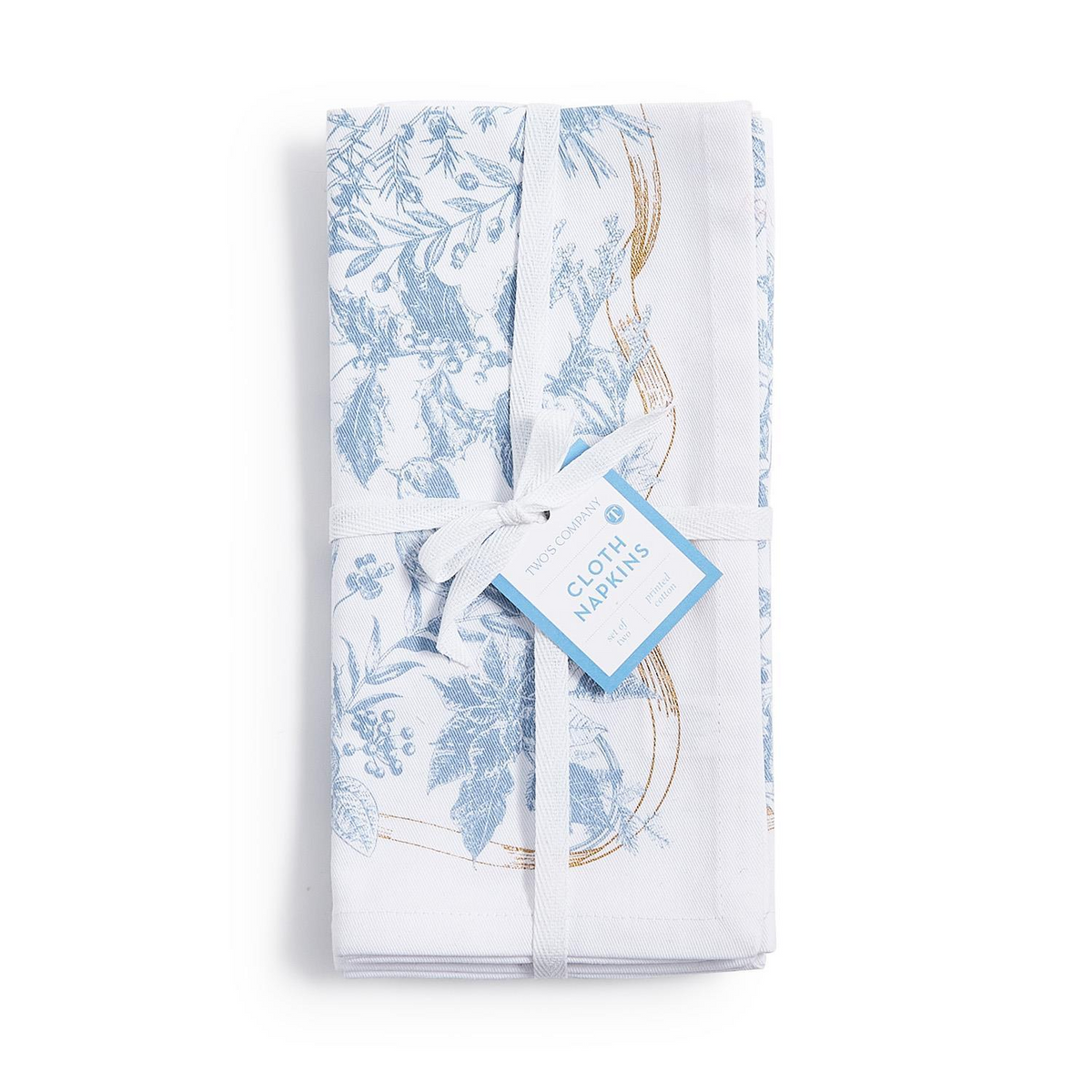 Set of four white cotton napkins with blue botanical designs and gold accents, tied with a ribbon.