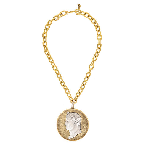 Gold chain necklace with a two-tone coin medallion featuring a classic profile of Cesar.
