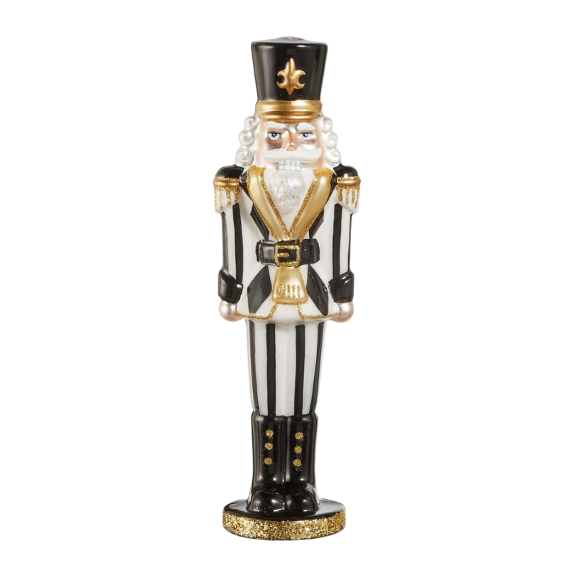 10.5-inch glass nutcracker ornament in black and white stripes with gold glitter accents.